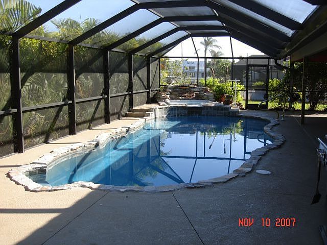 new pool with hot tub and waterfall