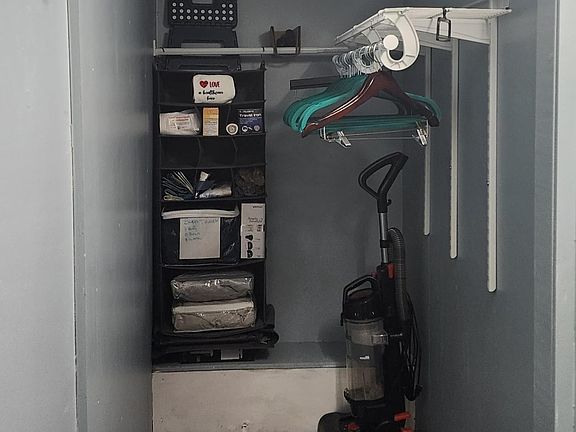 Large closet with above shelf storage. Items are not included