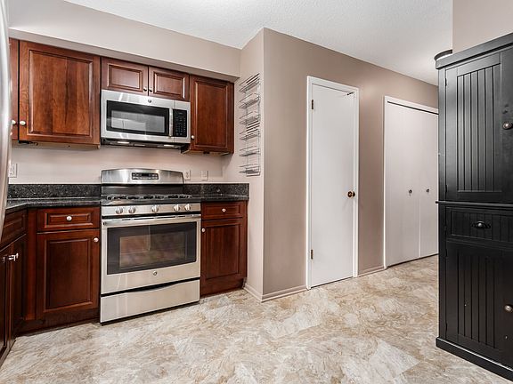 Kitchen with additional cupboard storage