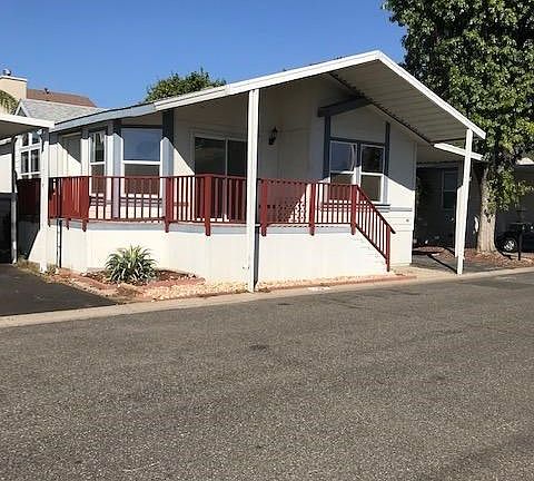 The front door is on the west side of the home the front porch offers a wonderful spot to sit and watch the world go by!