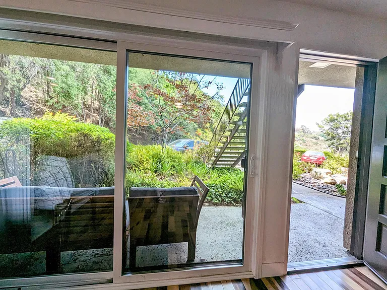 Screen door to optionally furnished porch
