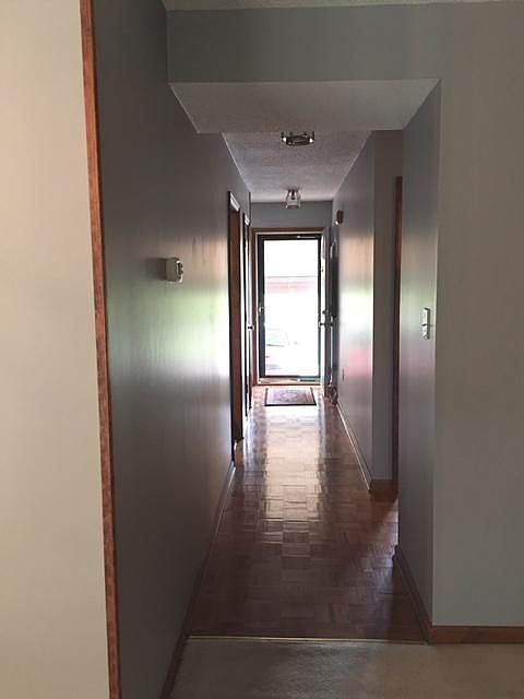 Foyer and hall leading to family room/dining room