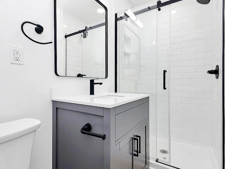 Newly renovated bathroom with modern fixtures.