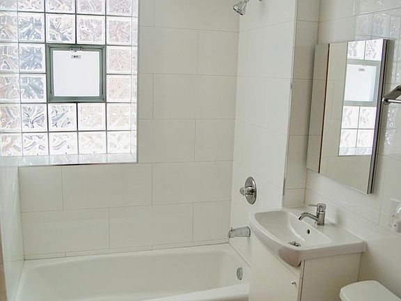 Freshly renovated bathroom, ceramic tile and flooring.