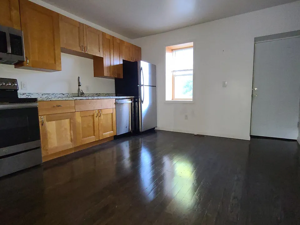 Updated kitchen with stainless steel appliances and hardwood floors throughout