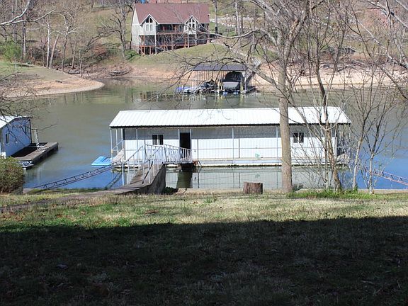 enclosed w/ 2 slips & fishing dock