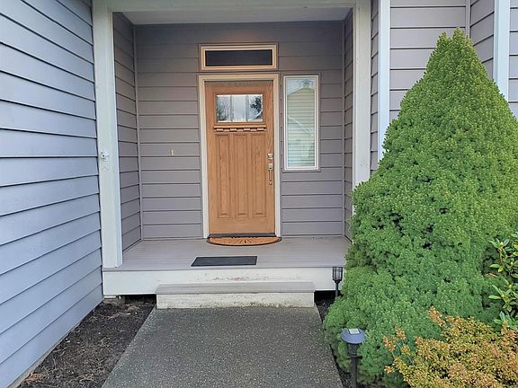 Welcome to a beautiful home. . Front door with covered porch.
