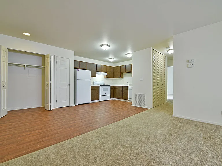 The open kitchen and living room in an apartment at Grand Bend Club Apartments