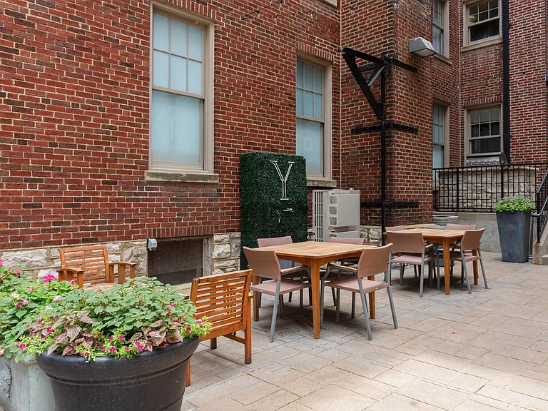 York House quaint courtyard with communal seating and grilling station