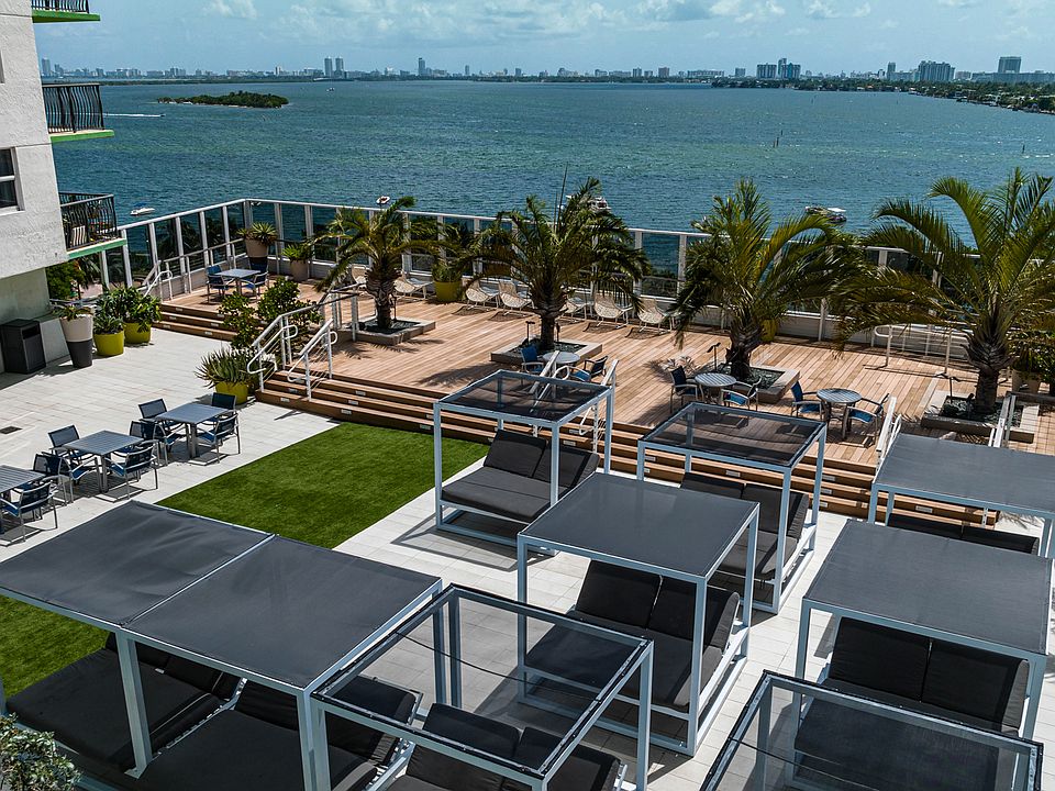 Expansive pool deck with cocktail service and stunning views of Biscayne Bay