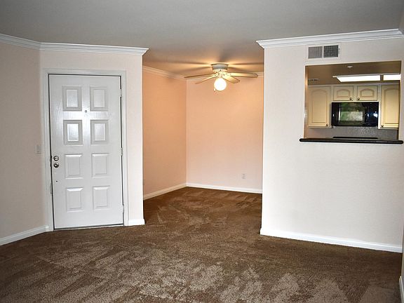 Family room open to kitchen and dining room.