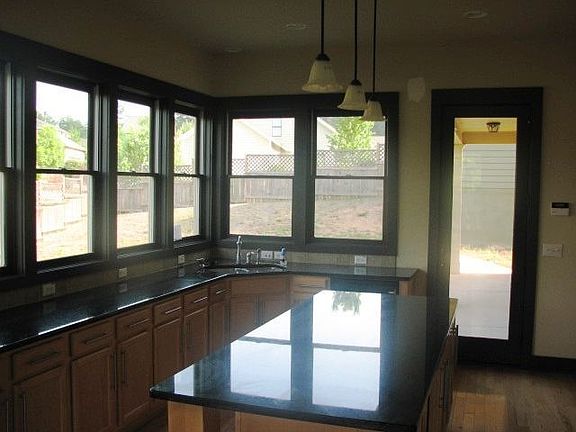 Gourmet kitchen with wall of windows.