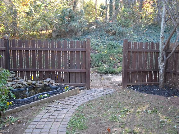 Privacy Fence with Koi Pond