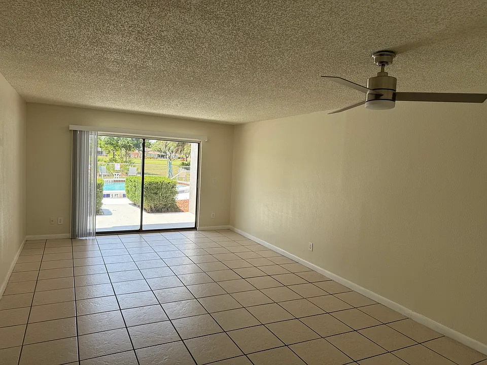 Living room and entry to patio and pool