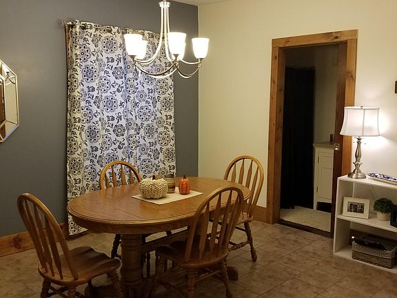 Dining room shown with tiled floor, new electricity, replacement window