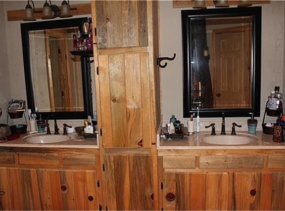 HIS AND HERS VANITY WITH PLENTY OF CABINET SPACE