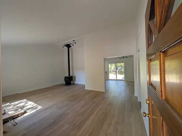 Living room with a working wood-burning stove.