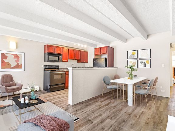 Open layout with modern kitchen and dining nook
