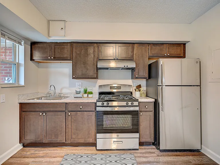 Recently Renovated Townhouse Style Apartments featuring New gray carpet, Neutral paint scheme, Premium hardwood-style flooring, Neutral paint scheme, Upgraded light fixtures, New cabinets, Matching stainless steel appliances, Washer/Dryer, Air conditionin