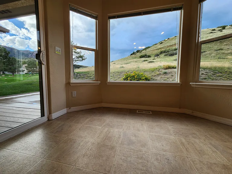 Views from Dining Nook off of Kitchen, Sliding Door on Left opens to Covered Deck