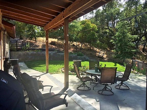 Another photo of the backyard patio and covered area!