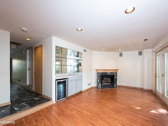 Multi use family room with wet bar and fireplace