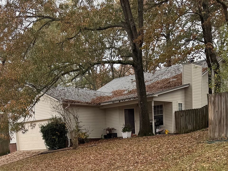 House on a hill! This is considered a story and a half home with a high vaulted ceilings.