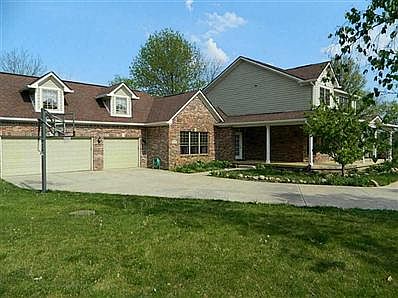 Exterior Front. Basketball goal stays with this house. 3 car garage!