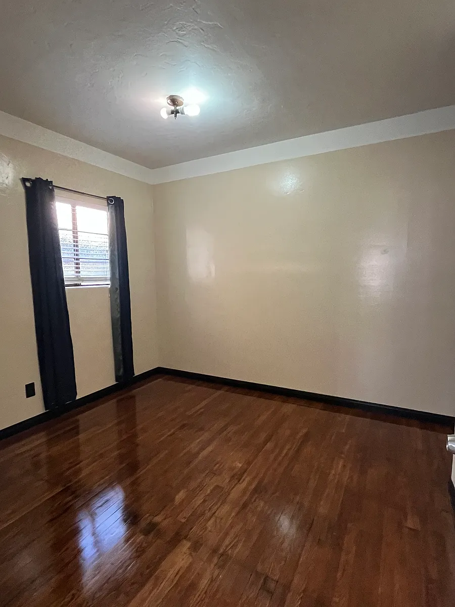 Photo 2 of 6 - 2613 B St - San Diego, CA Bedroom with freshly coated oak floor, and newly painted walls. - 2613 B St