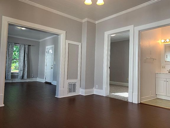 Dining room looking into living room, master bedroom and bathroom