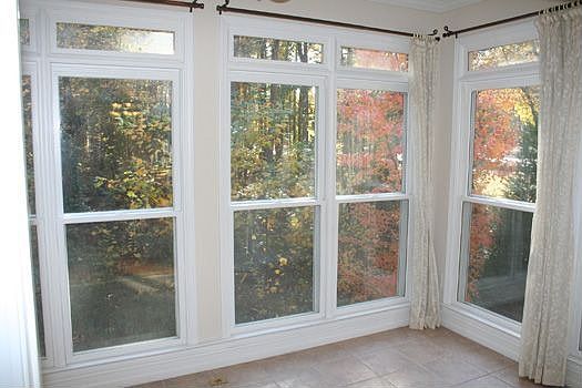SUNROOM OFF OF THE KEEPING ROOM HAS TILE FLOORING.