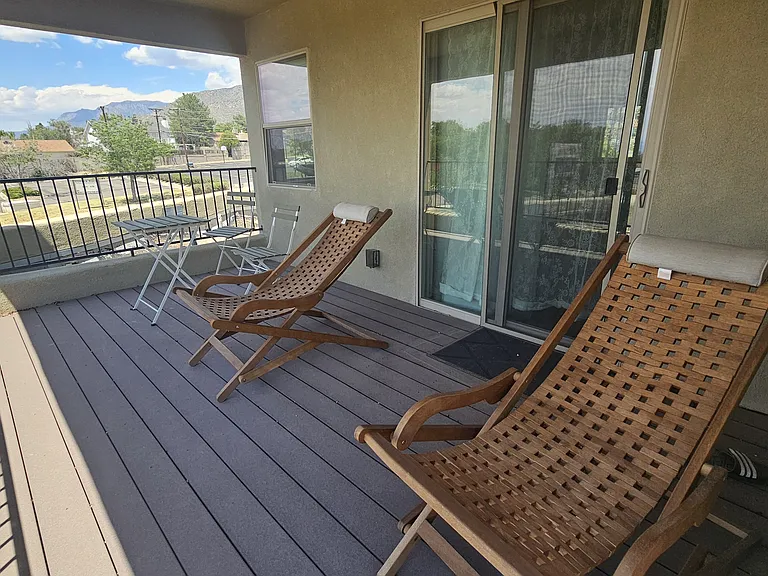 Second-floor covered deck area with view of the mountain
