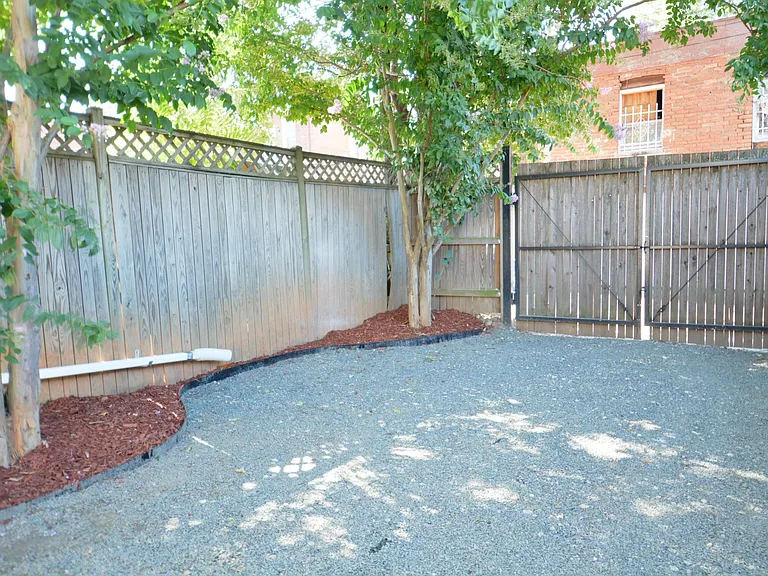 Backyard parking area. Roll up door now.