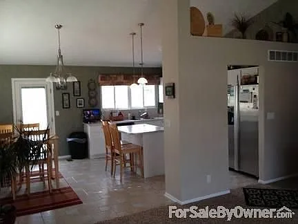 Kitchen/Living room
						:
						Tile floors with archway, door leads out to deck, stainless steel appliances.