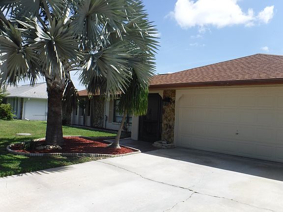 Beautiful palms at front.