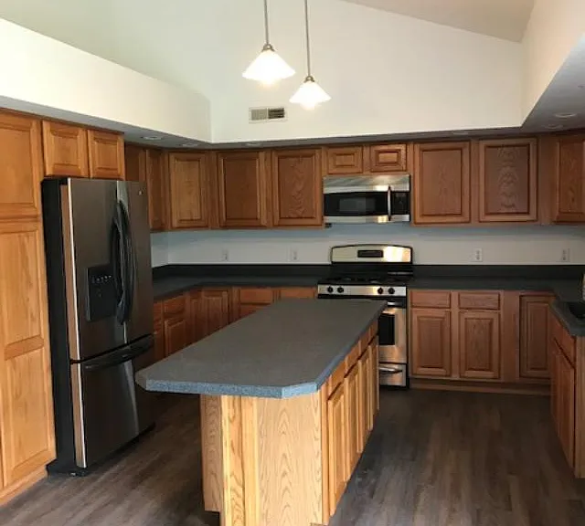 Kitchen with stainless steel appliance