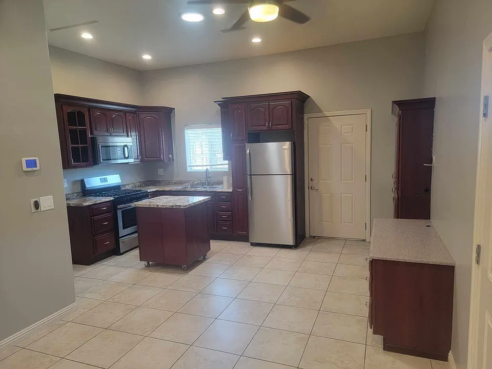 Kitchen with built in desk and island.