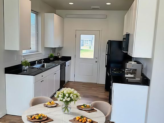 Extra Wide Galley Style Kitchen With Quartz Countertops, Newer Appliances, Back Patio Access