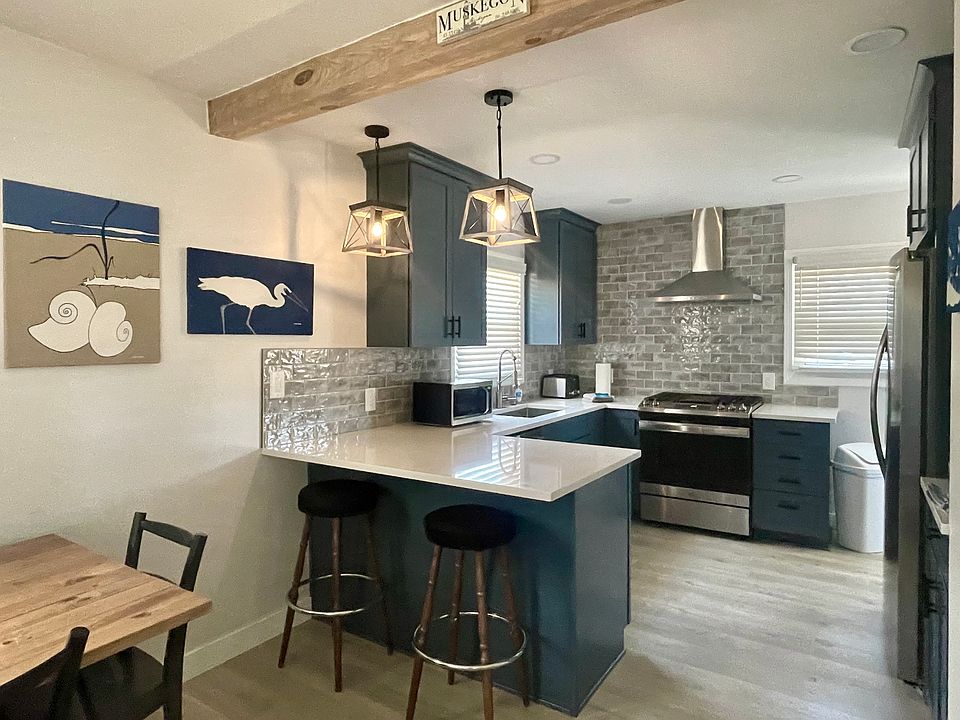 Kitchen with full sets of dinnerware, cutlery, pots & pans