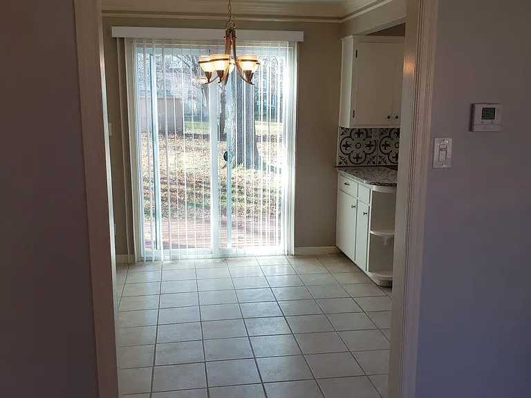 Open concept from living room to dining room to kitchen ......and a slider door to the huge back deck.
