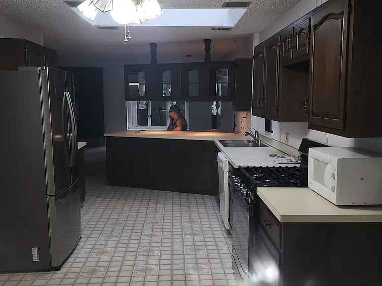 Huge Kitchen seen from desk area at one end.