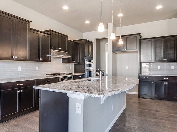 Gorgeous kitchen with granite counter tops and an eat-at island.