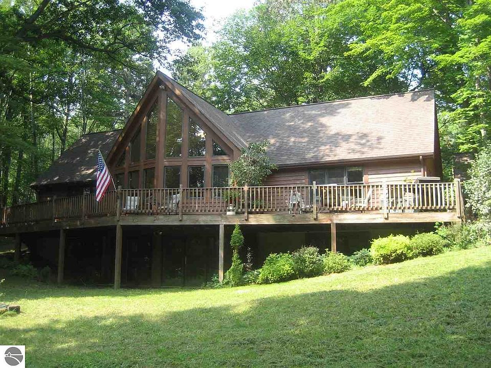 22' of decking on the front of the home that is in the process of being re-stained.  Unfinished walkout lower level below the deck.