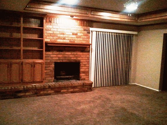 Living Room w/Built-In Cabinets and Fireplace