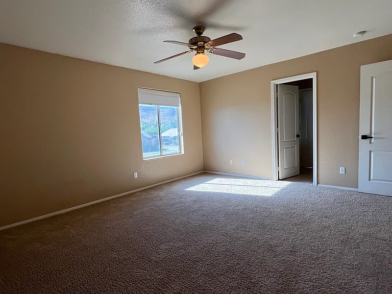 upstairs bedroom with walk in closet and access to full bathroom (shower and tub and toilet in separate room from double sinks) shared with another bedroom, great mountain views, linen closet & laundry shoot in hallway nearby