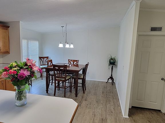 Dining area, master bedroom door on the right.