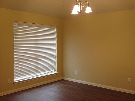 Front room can be used as Dining or Study. Vinyl plank flooring throughout and blinds on all of the windows.