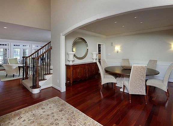 Entry opens to a glorious dining room and view of French doors that open to the covered patio and pool.