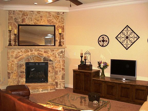 Living room with beautiful stone fireplace