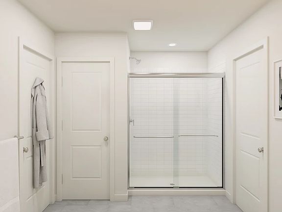 Primary bath with chrome shower enclosure